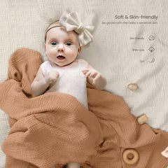 lulumoon muslin swaddle blanket caramel baby wrapped demonstrates snug wrap for calm, sleep-ready moments