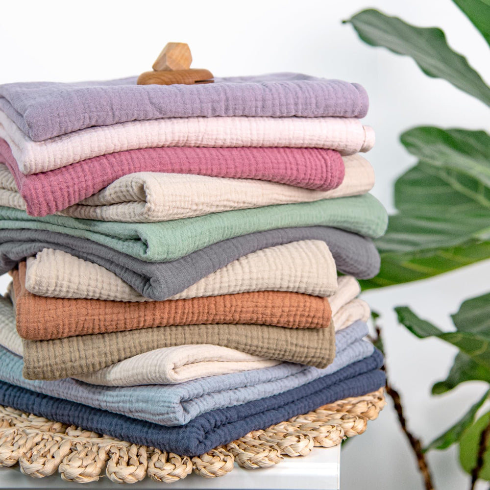 lulumoon muslin swaddle blanket multi-use with nursing cover in-use shot
