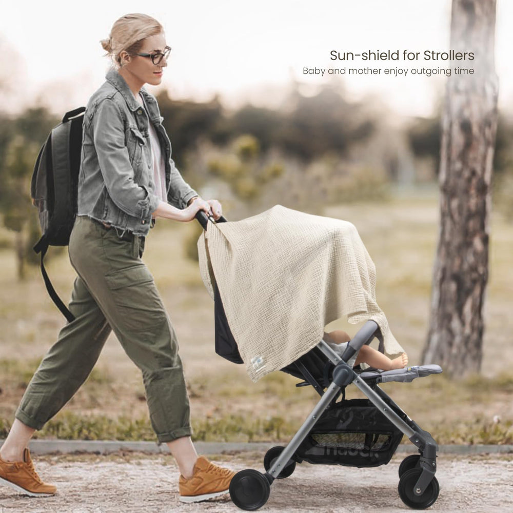 Care label on Lulumoon Muslin Swaddle Olive for easy washing guidance.