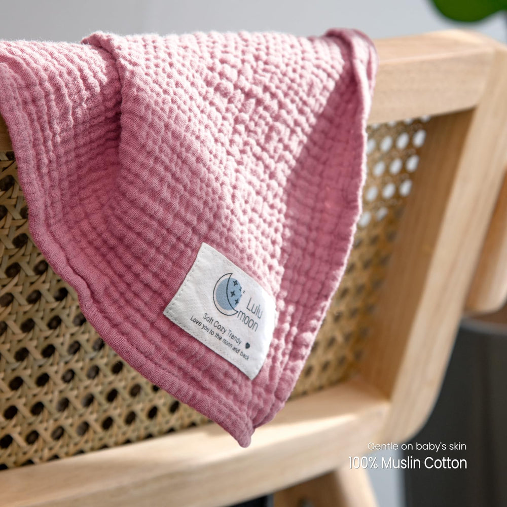 lulumoon muslin swaddle blanket pink close-up reveals soft tone and gentle texture
