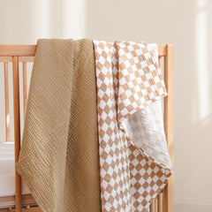 lulumoon Muslin Swaddle Blanket plaid mocha showcases stylish nursery decor and cozy wrap