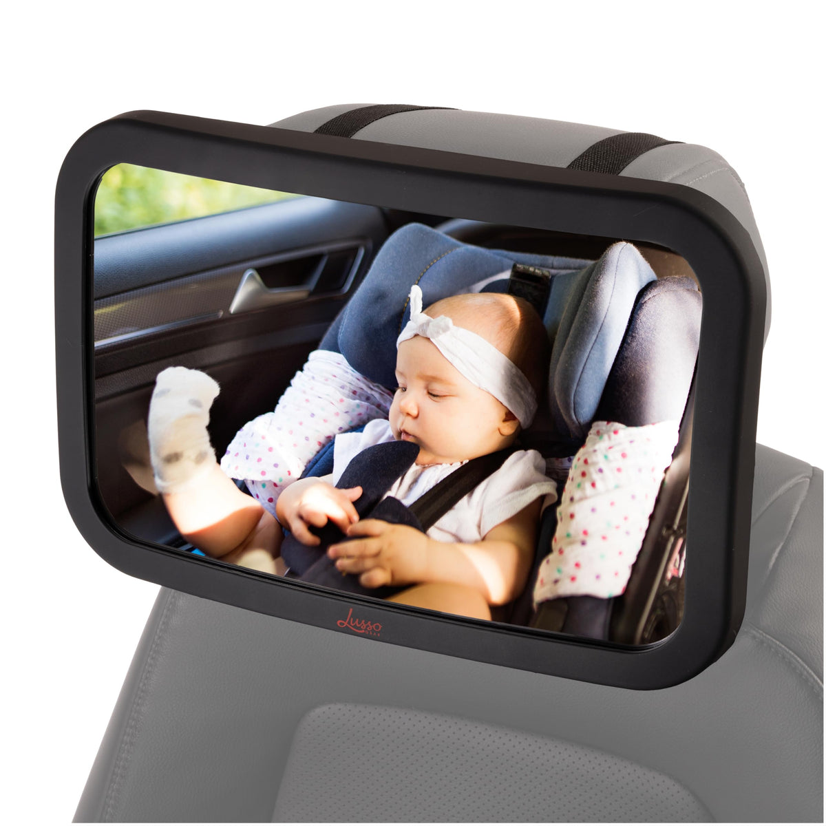 Lusso Gear Baby Car Mirror mounted on headrest for easy monitoring on the road.