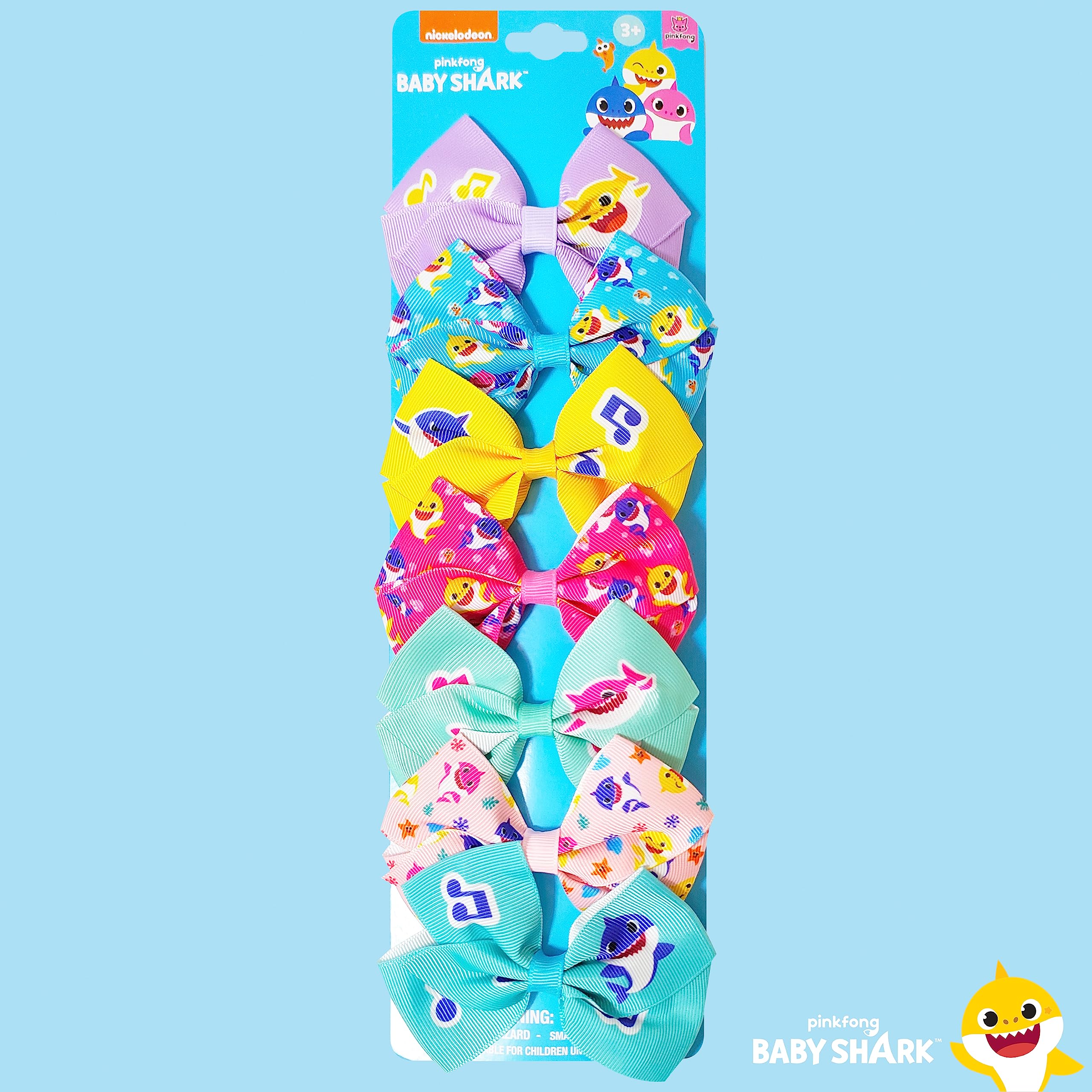 Kids wearing LUV HER Baby Shark bows during playtime for easy styling.