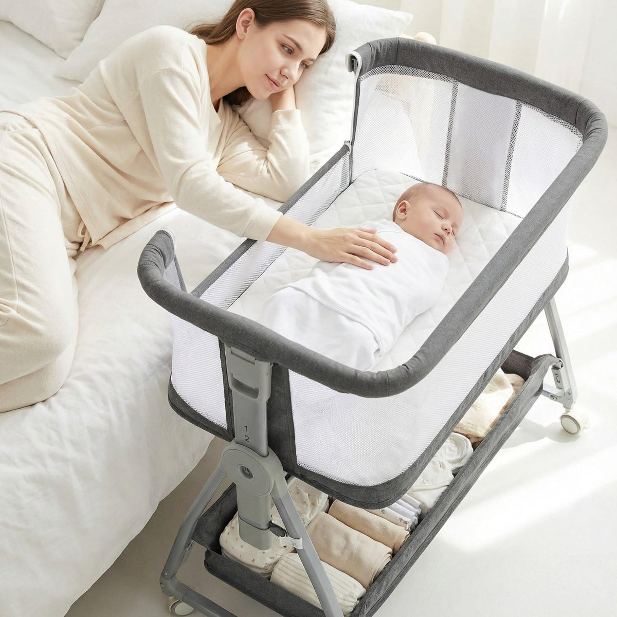 Luvkixen 3-in-1 bedside sleeper beside parent for night feeds.