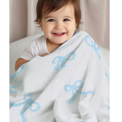 Luxape Bow Blanket blue bows closeup highlighting ultra-soft plush fabric for baby comfort.