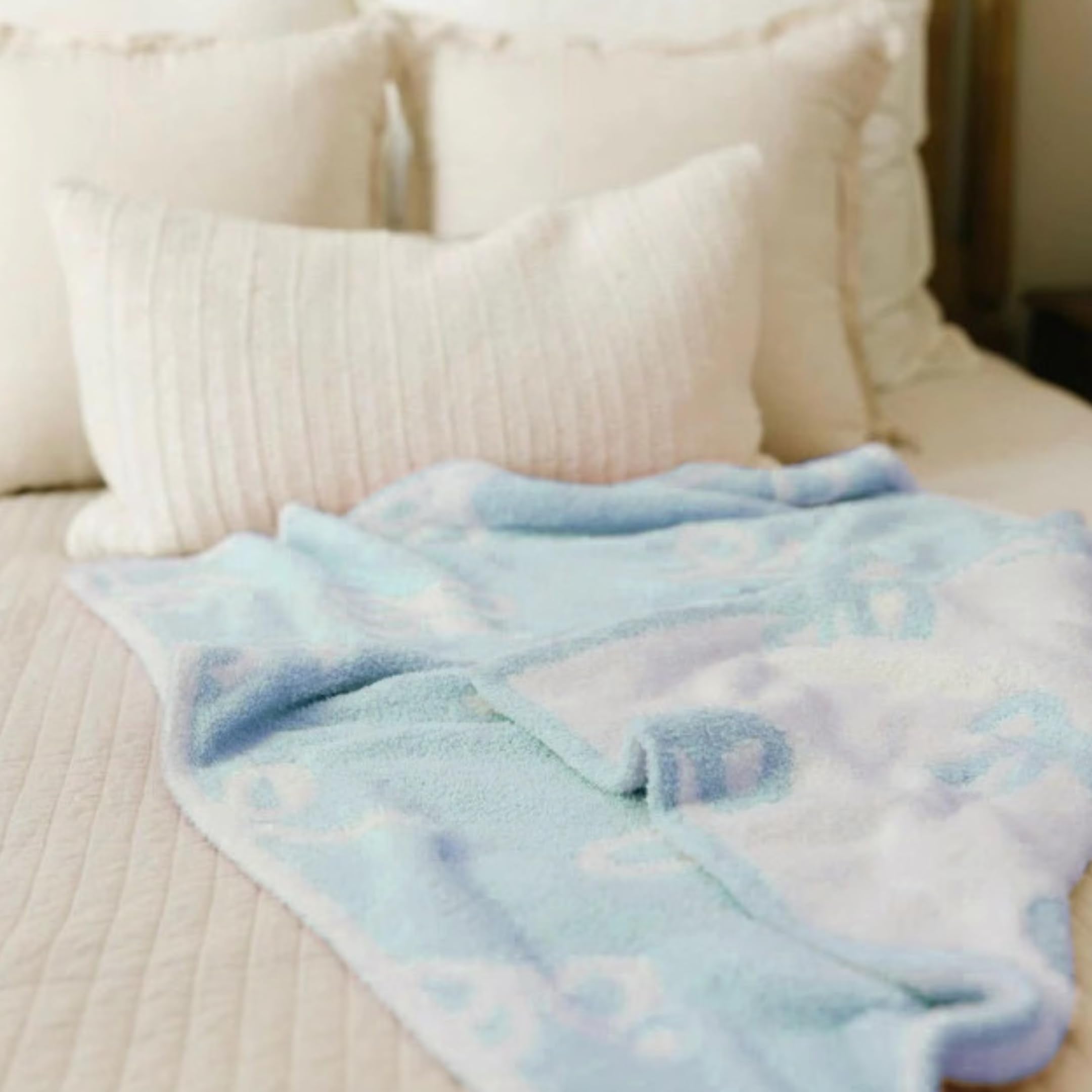 Luxape Bow Blanket blue bows detail fabric close shot emphasizes premium material.