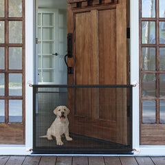 LWFCOEE mesh dog gate on a doorway provides a safe boundary for pets.