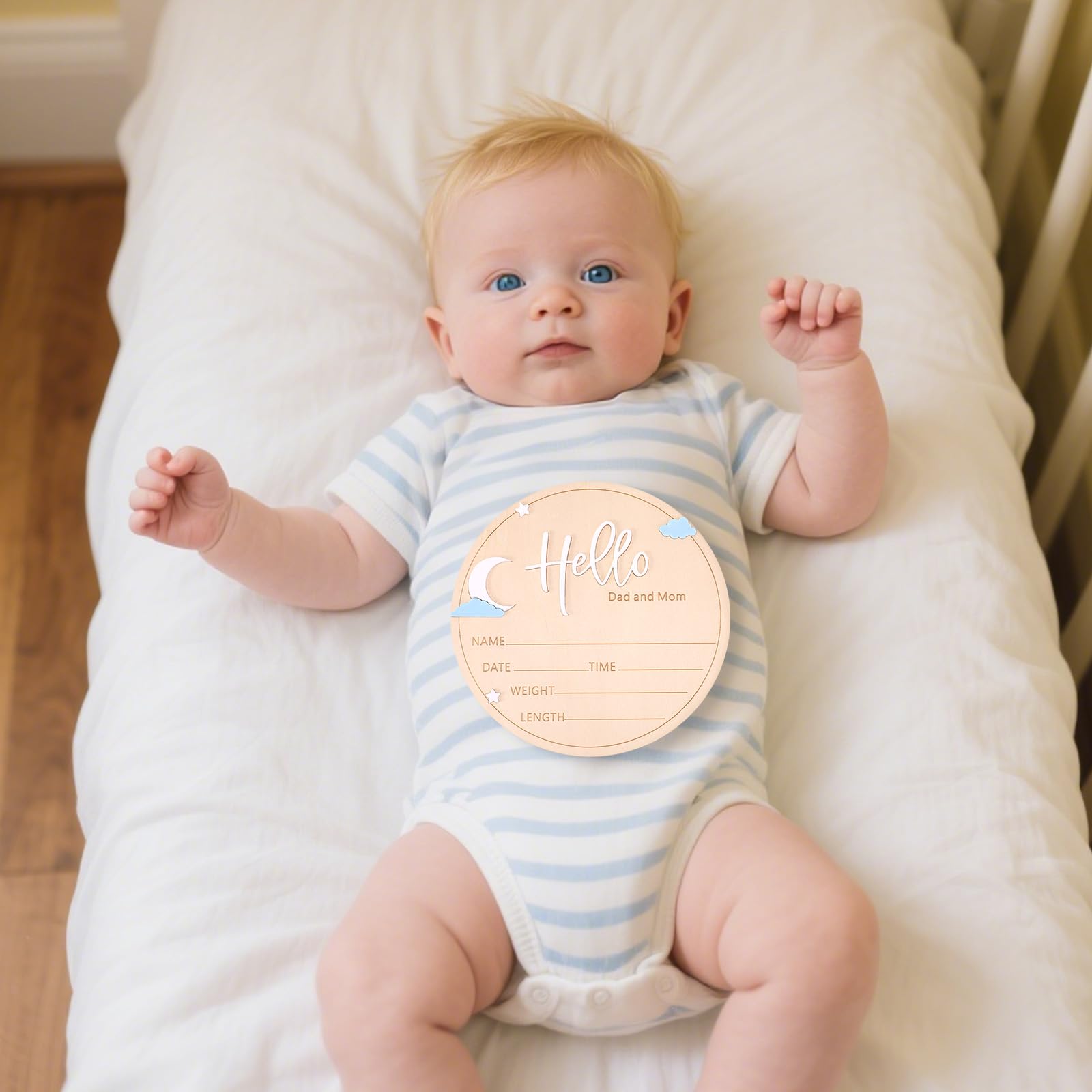 Lyreh round wooden sign used as a photo prop for cherished newborn memories.