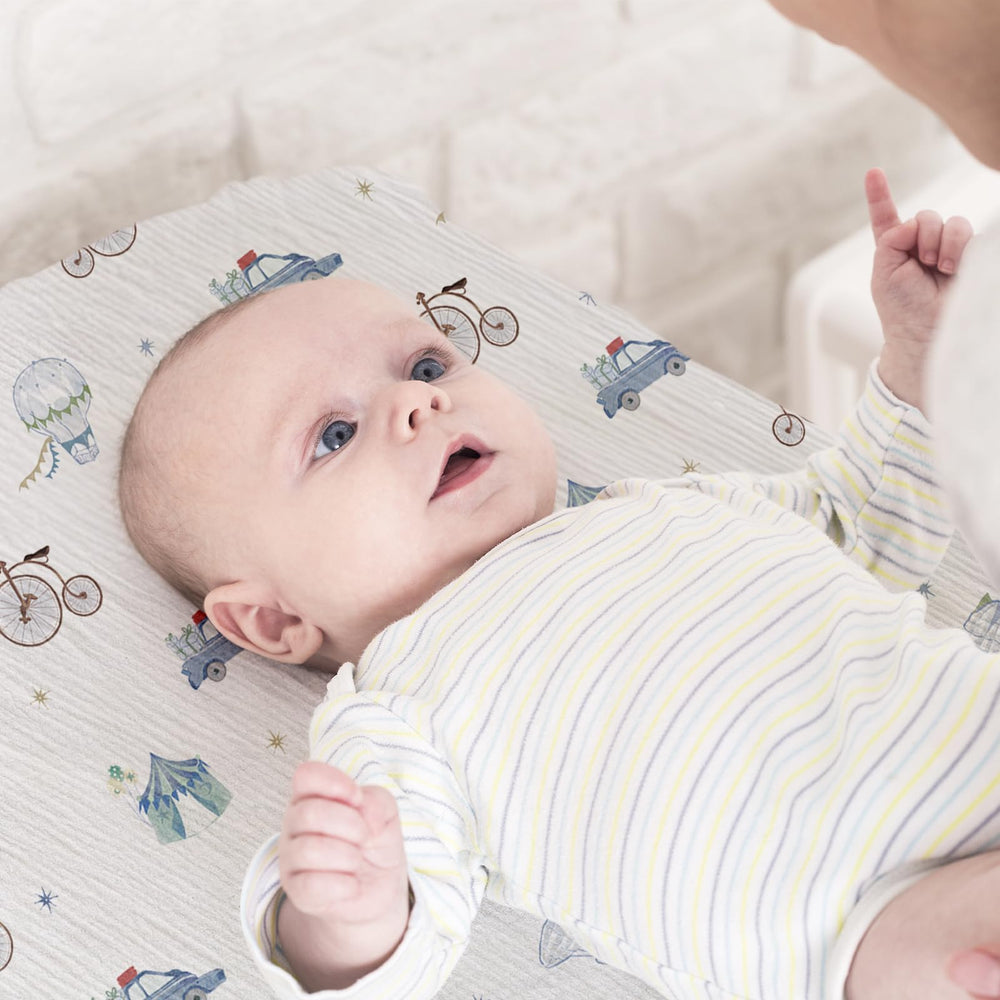 LYRICHOM BABY bassinet oval-fit sheet demonstrates snug 360-degree elastic fit for secure sleep.