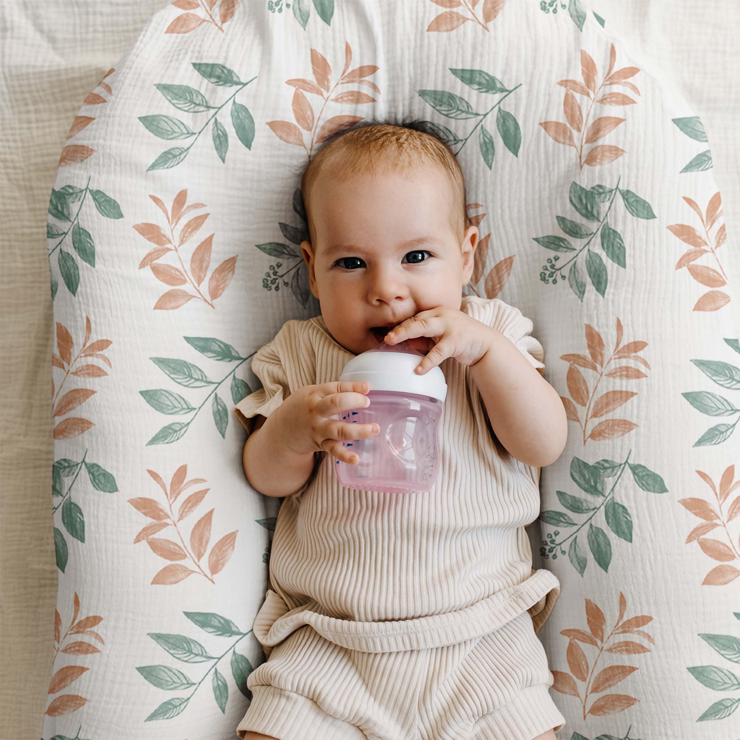 LYRICHOM BABY Bright Leaves bassinet sheet on mattress snug stretch fit for secure overnight sleep.