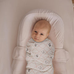 LYRICHOM BABY organic cotton swaddle wrap with adjustable wings enables secure, cozy newborn swaddling.