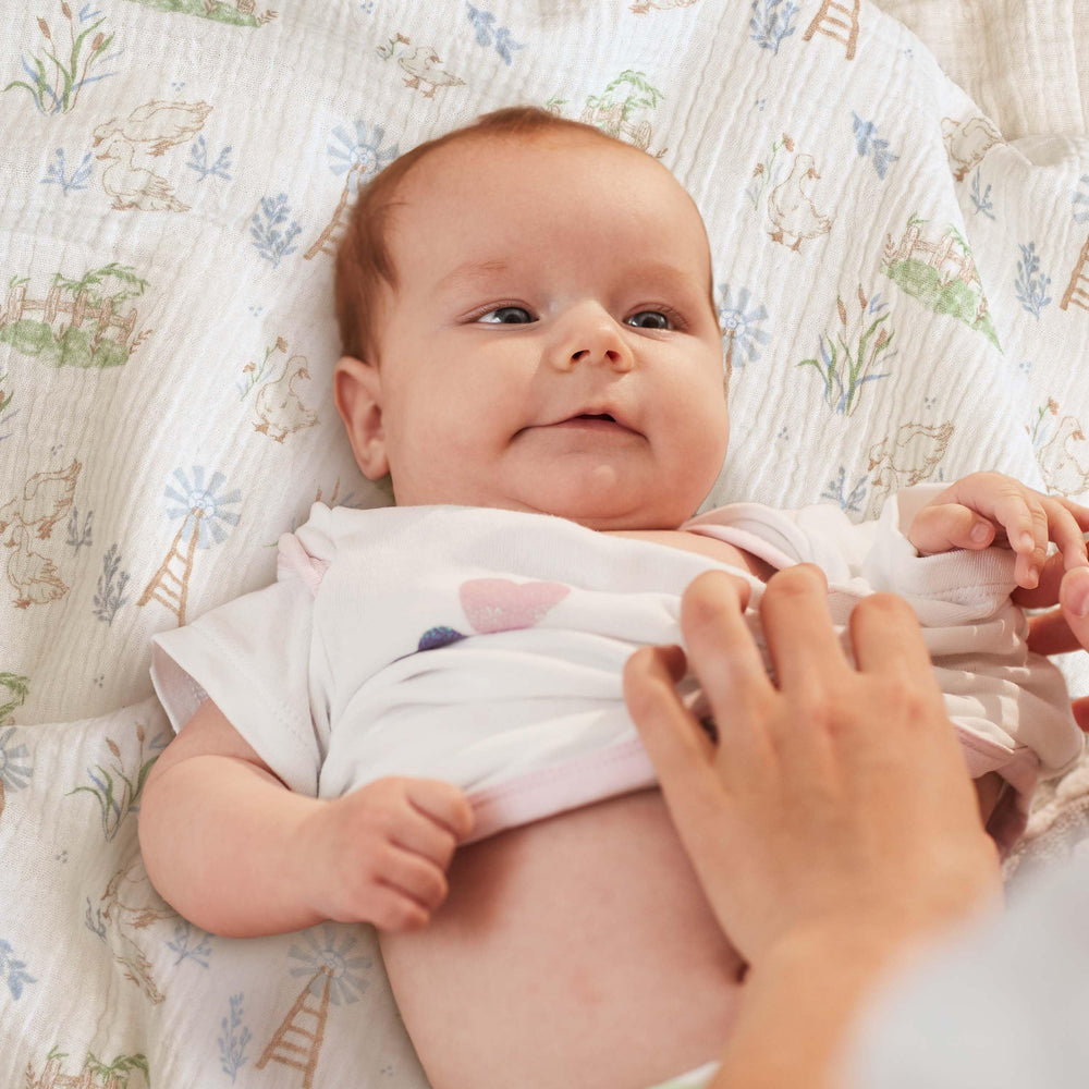 LYRICHOM BABY swaddle nursing cover shows cozy privacy during feeding.