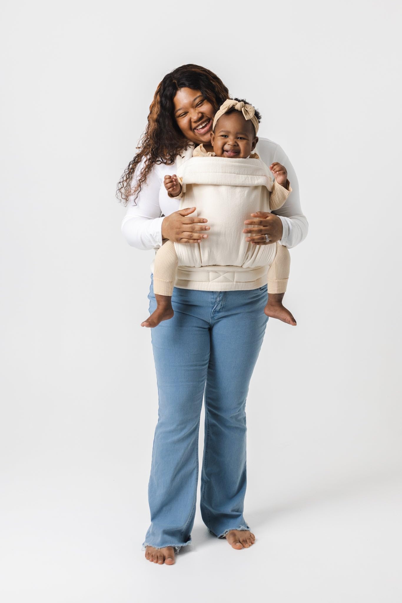 Mabē Monarch ergonomic baby carrier ivory front carry shows hands-free convenience for errands