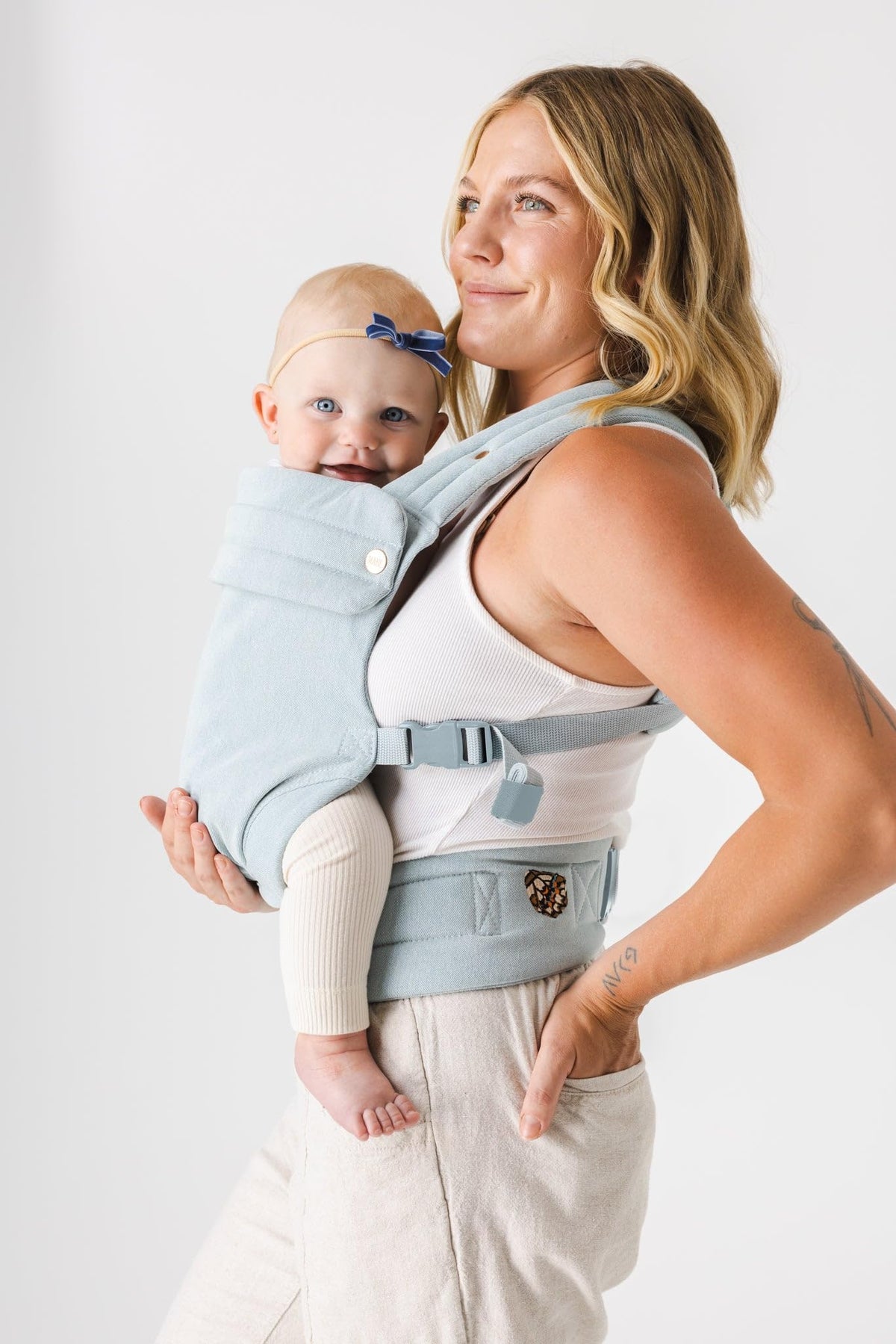 MABE Monarch front-facing-in view in denim shows newborn-friendly ergonomic fit.