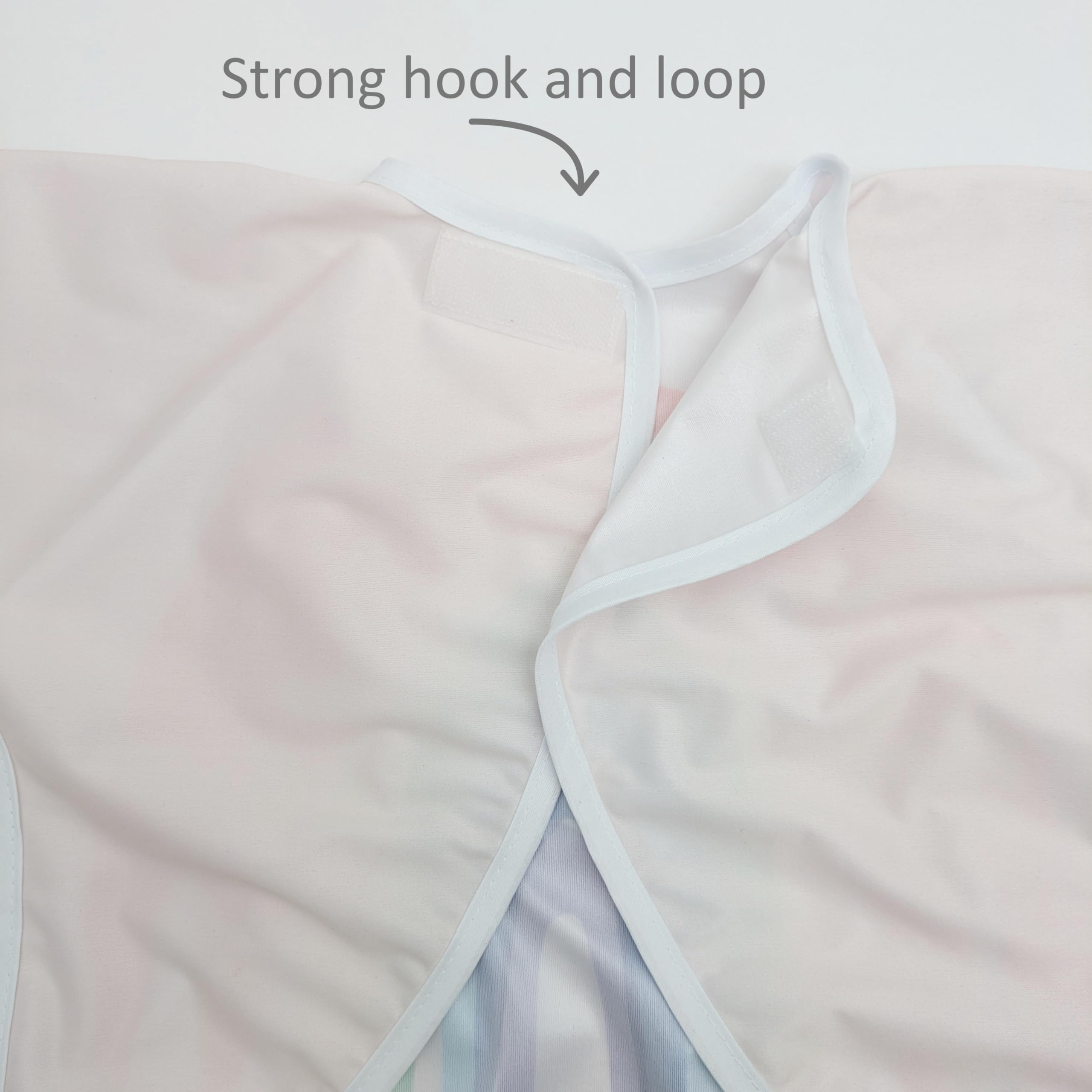 Madrona Brands Happy Rainbow bib-pocket-catch-all keeps crumbs contained and snacks handy.
