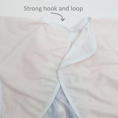 Madrona Brands Happy Rainbow bib-pocket-catch-all keeps crumbs contained and snacks handy.