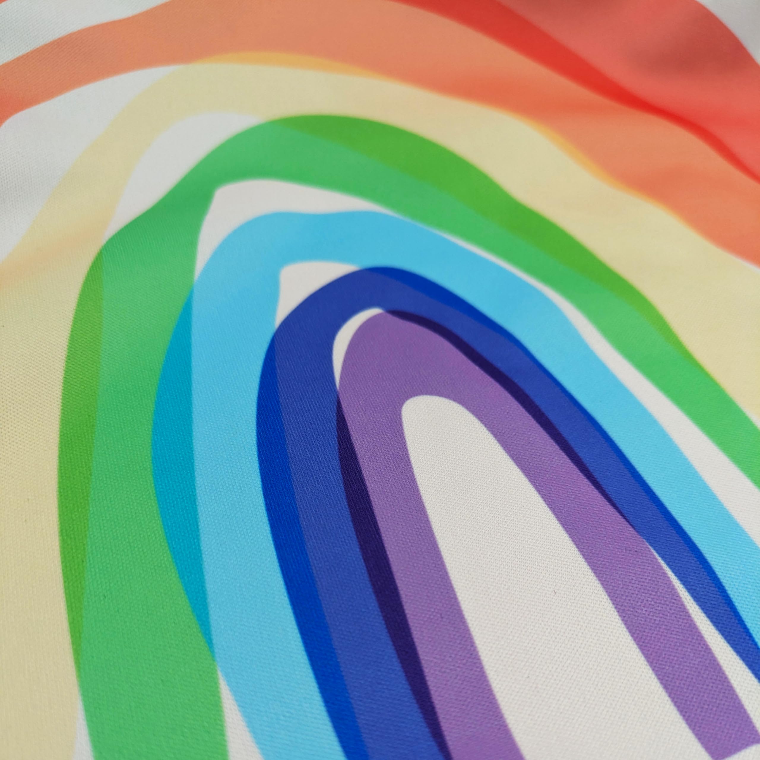 Madrona Brands Happy Rainbow bib-wipe-clean shows effortless cleanup after crafts and meals.