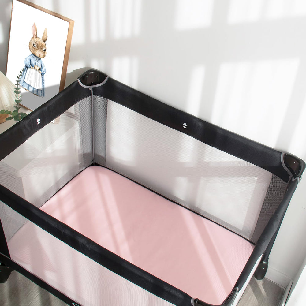 Magik & Kover sheets on standard playard mattress show secure, snug fit