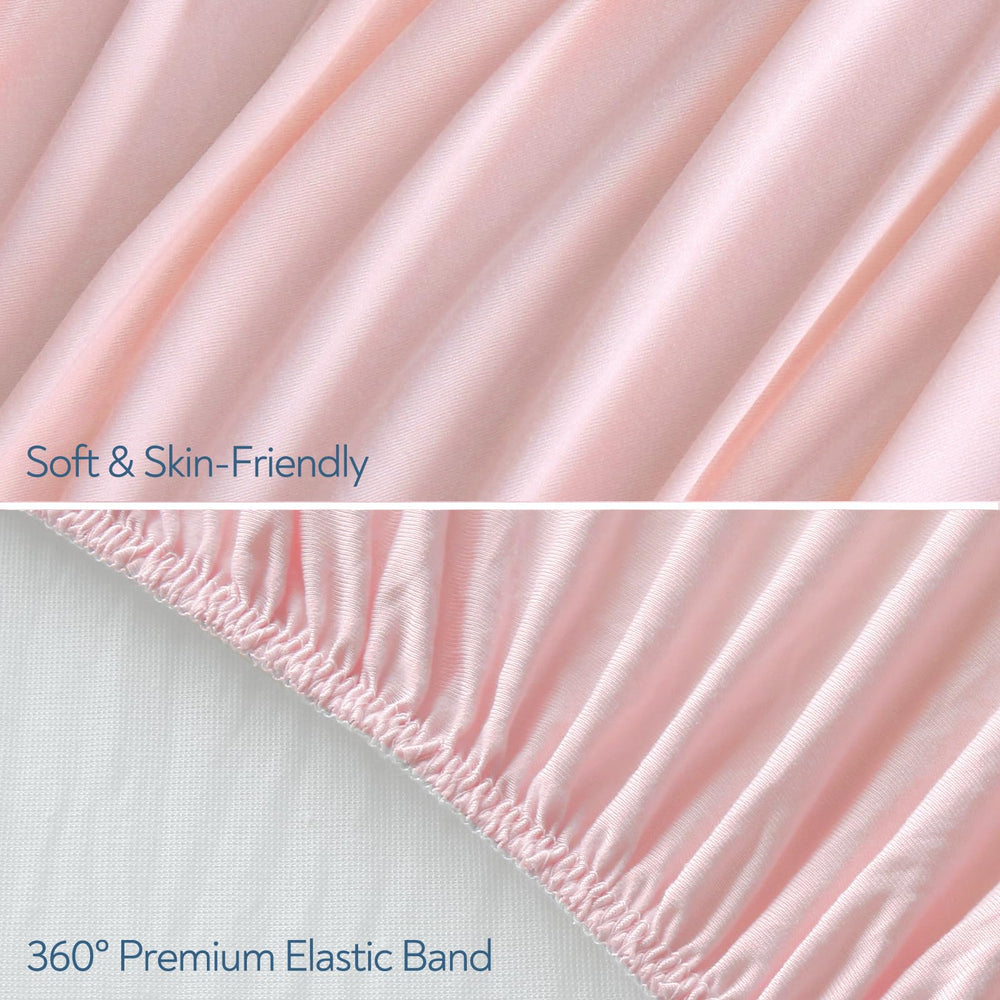 Magik & Kover pink stretchy crib sheet on mattress highlights snug fit for crib and toddler bed.
