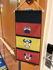 Magopera DCL door hanger on cabin door close-up of stitching and fabric