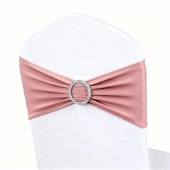 Magtowne dusty rose chair sash draped on a chair for elegant wedding decor.
