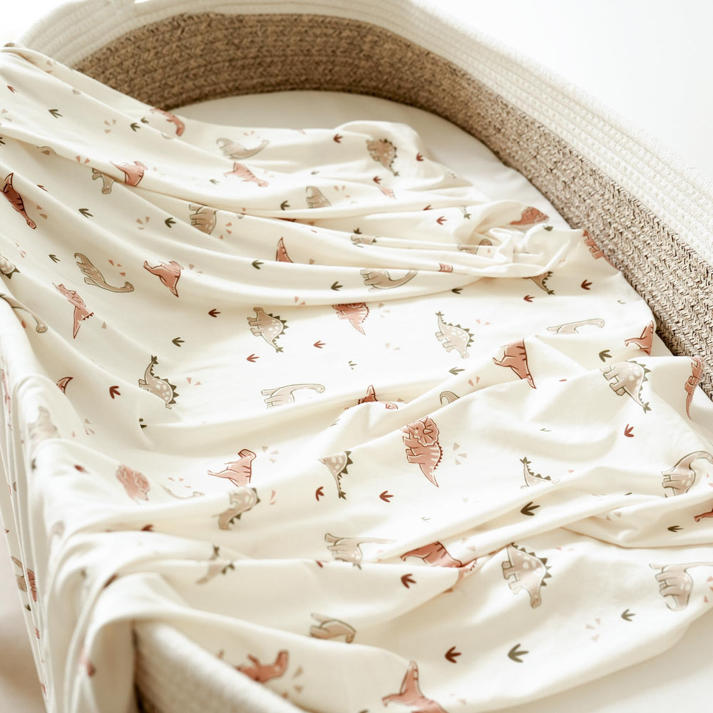 MairMore swaddle in emerald green dinosaurs design for elegant photos