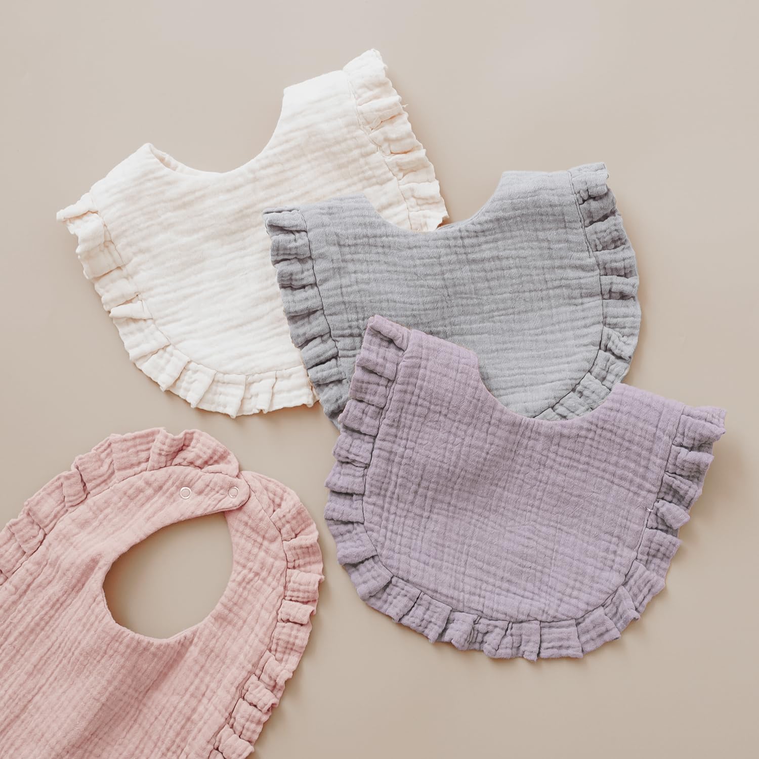MairMore bandana bib with flounce-lace border adds elegant touch.