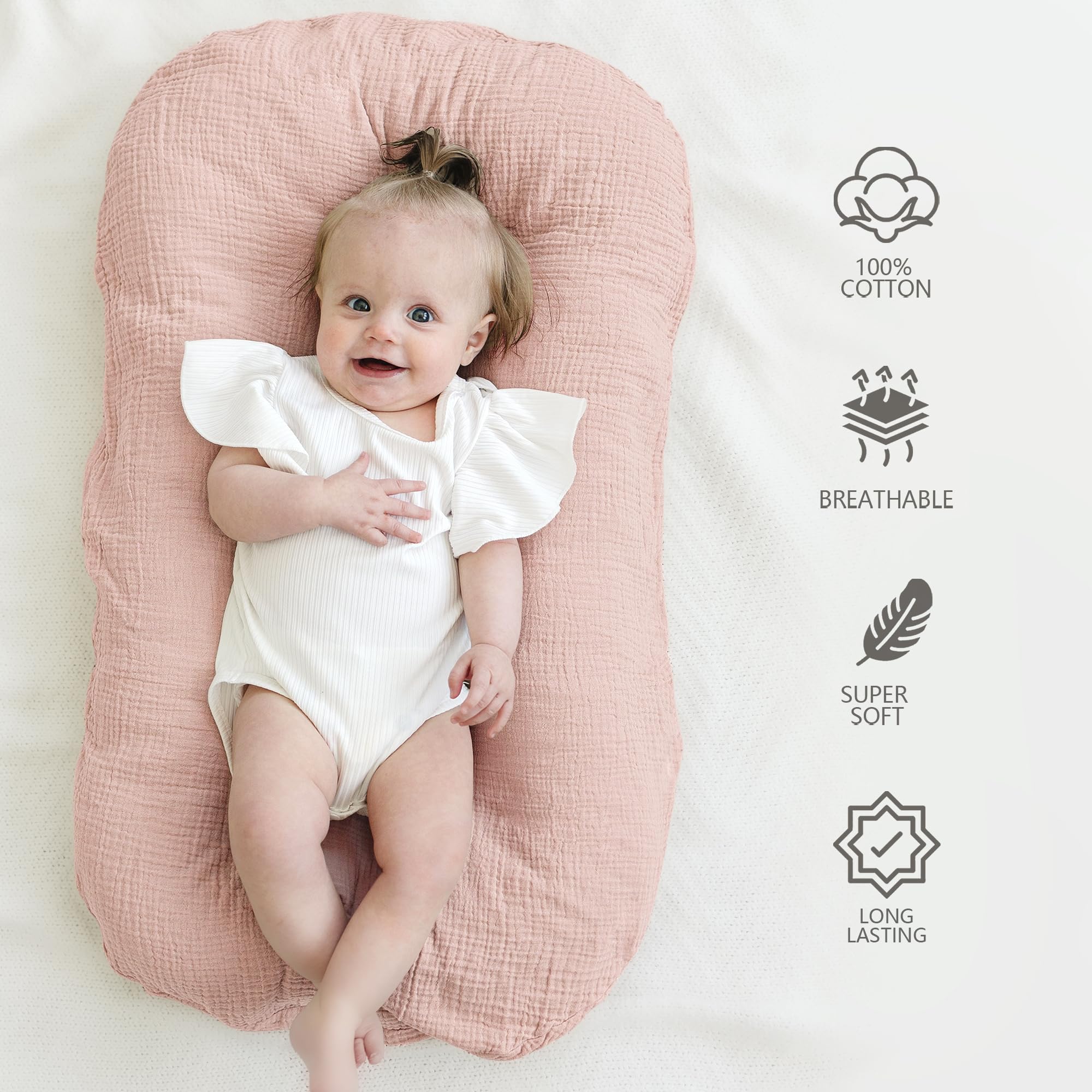 MairMore muslin baby lounger cover in ivory close-up showing gentle fabric and airy breathability.