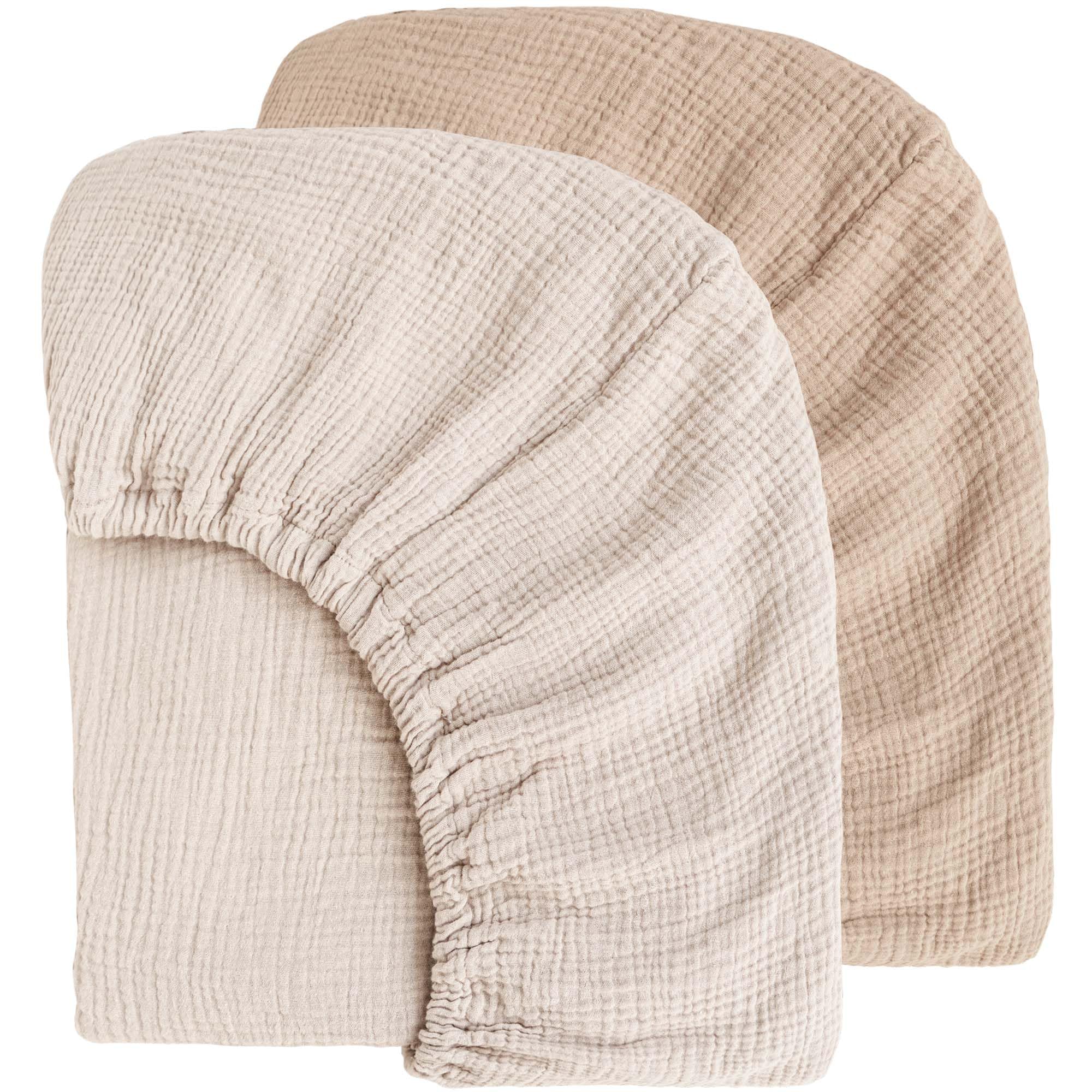 MairMore Muslin crib sheets with soft-touch feel support cozy newborn sleep.