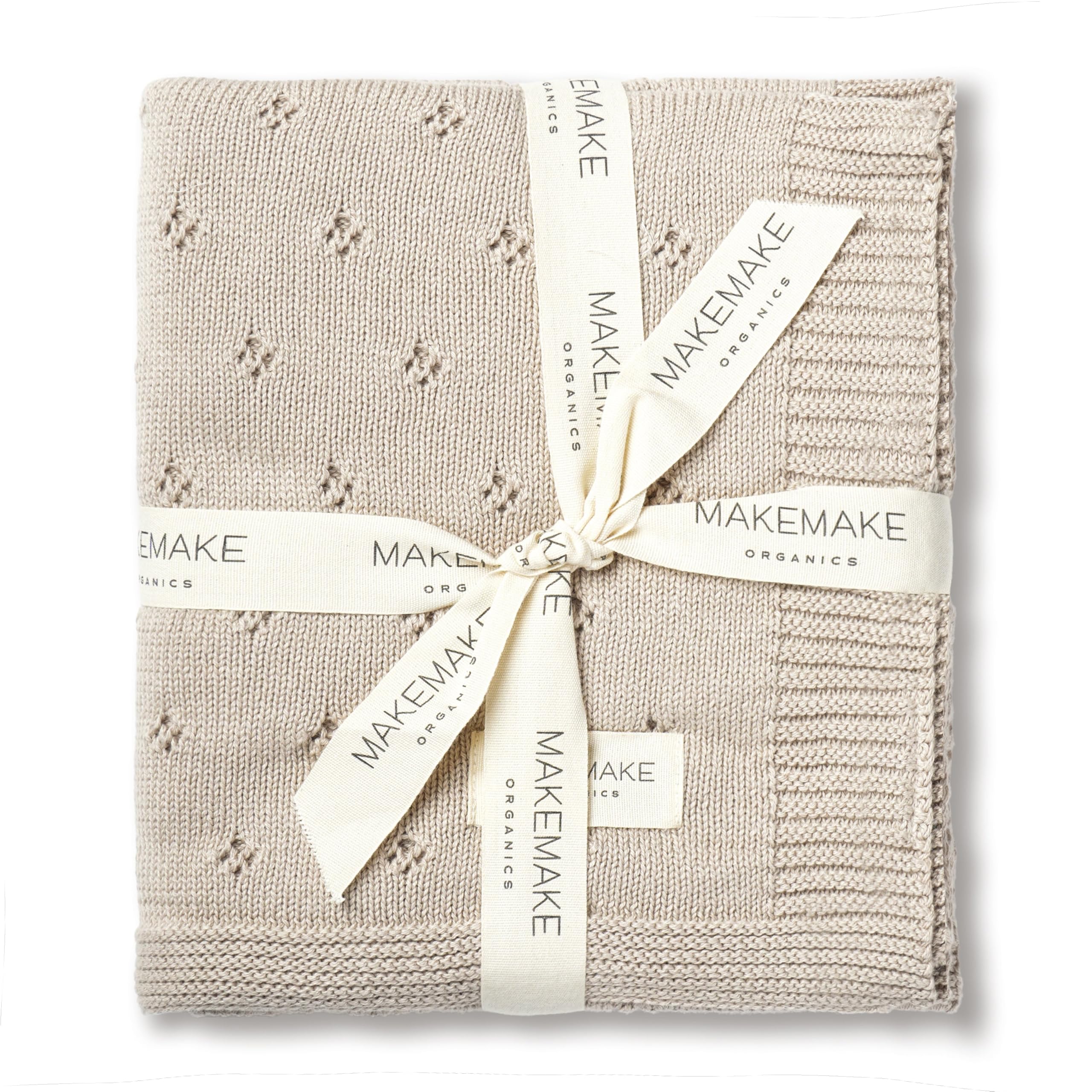 MakeMake Organics baby blanket beige-knit close-up highlights ultra-soft organic cotton for sensitive skin.