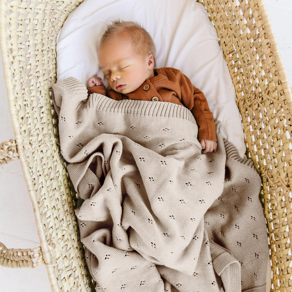 MakeMake Organics baby blanket beige-texture reveals breathable pointelle knit ideal for airy warmth.
