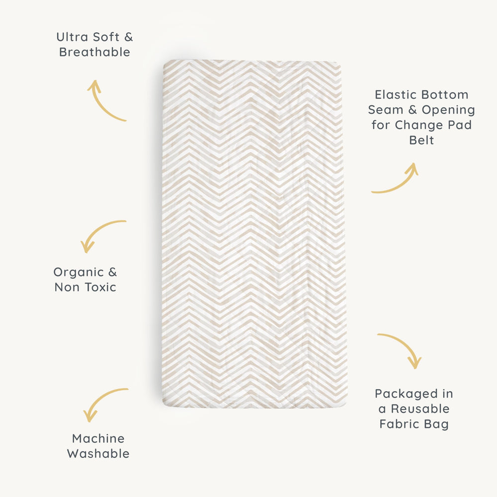 Makemake Organics changing pad cover organizer pocket helps store creams and wipes.