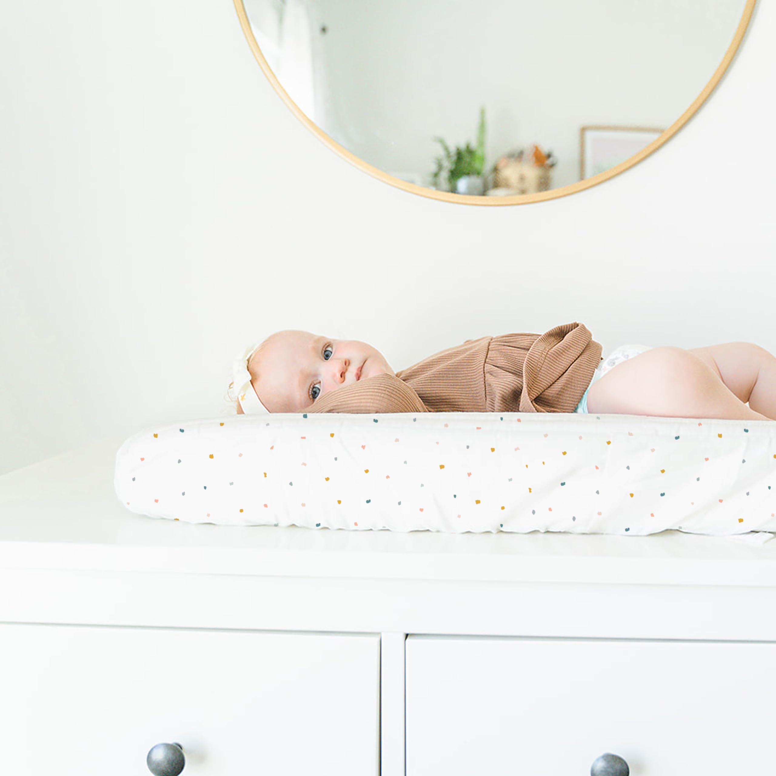Makemake Organics Dotty changing pad open with all-in-one clutch layout ready for quick diapering
