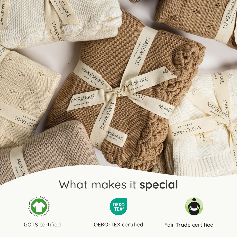 Makemake Organics unisex design blanket: neutral ivory fits any nursery.