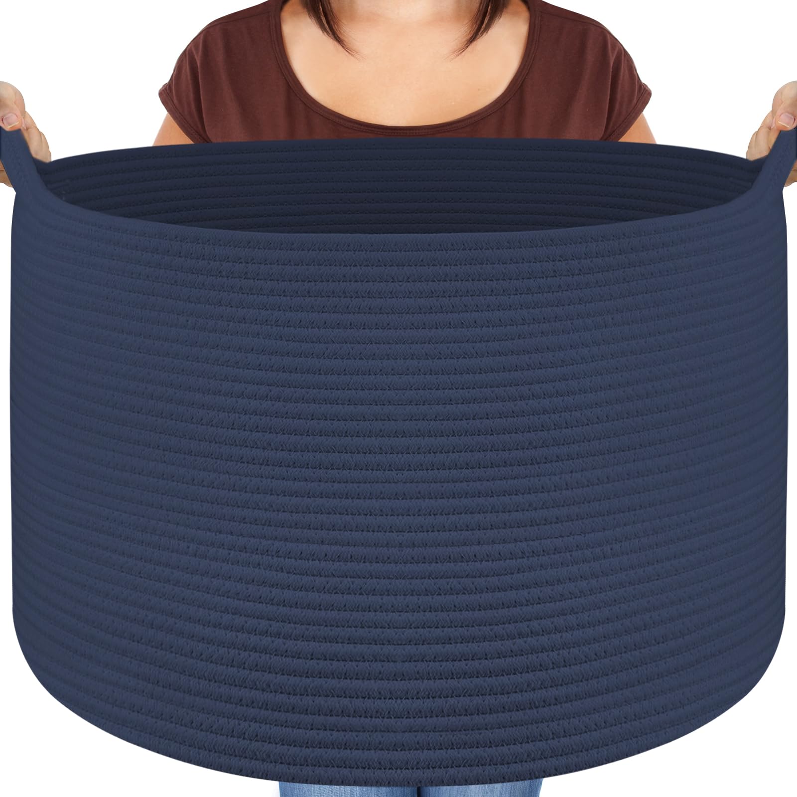 Maliton extra-large basket storing blankets in the living room for clutter-free space.