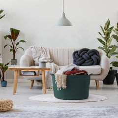 Maliton green laundry hamper in woven style adds soft texture to space.