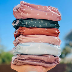 Mama Koala 3.0 pocket diaper side snaps enable easy on/off and fit.