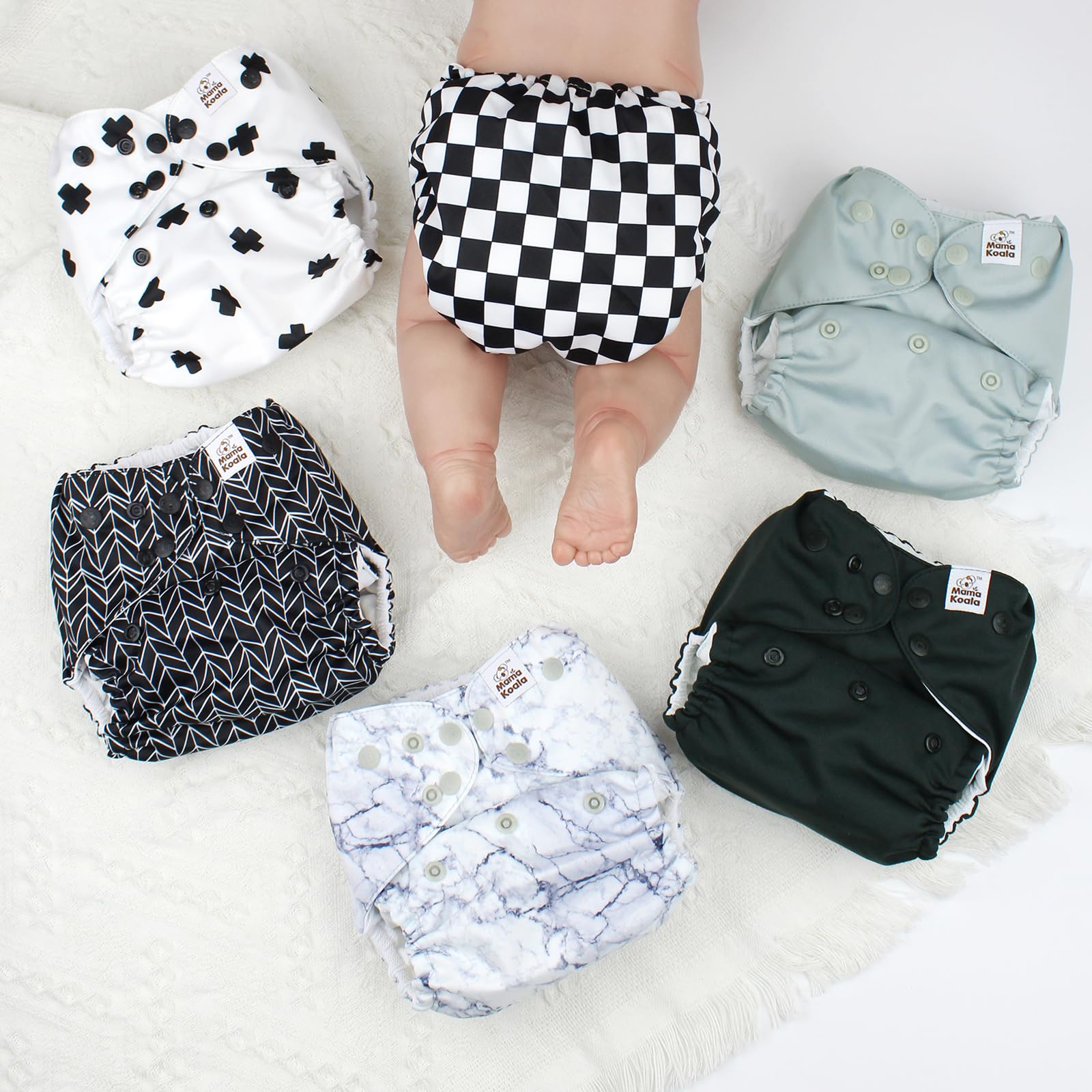 Mama Koala 3.0 pocket diaper close-up of crossover and hip snaps for secure fit
