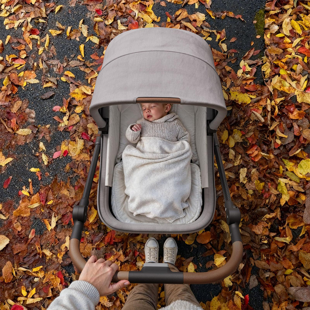 MAMAZING Air Lux storage basket holds essentials for day trips.