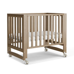 MAMAZING EvoNest crib with wheels in brown finish for easy mobility