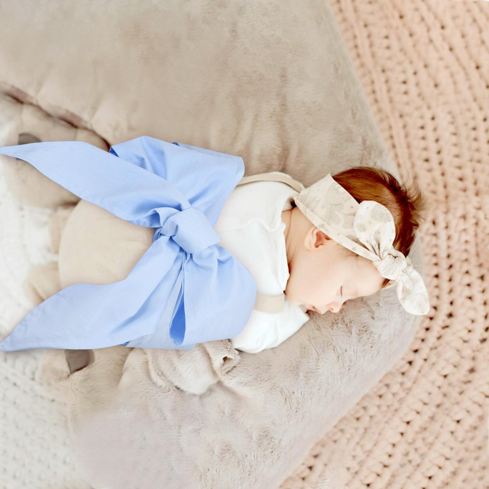 Man Fai Sky soft cotton texture swaddle sash on blue fabric.