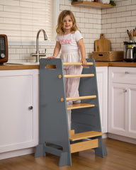 Mangohood toddler standing tower with closed design prevents leg entrapment during play and learning.