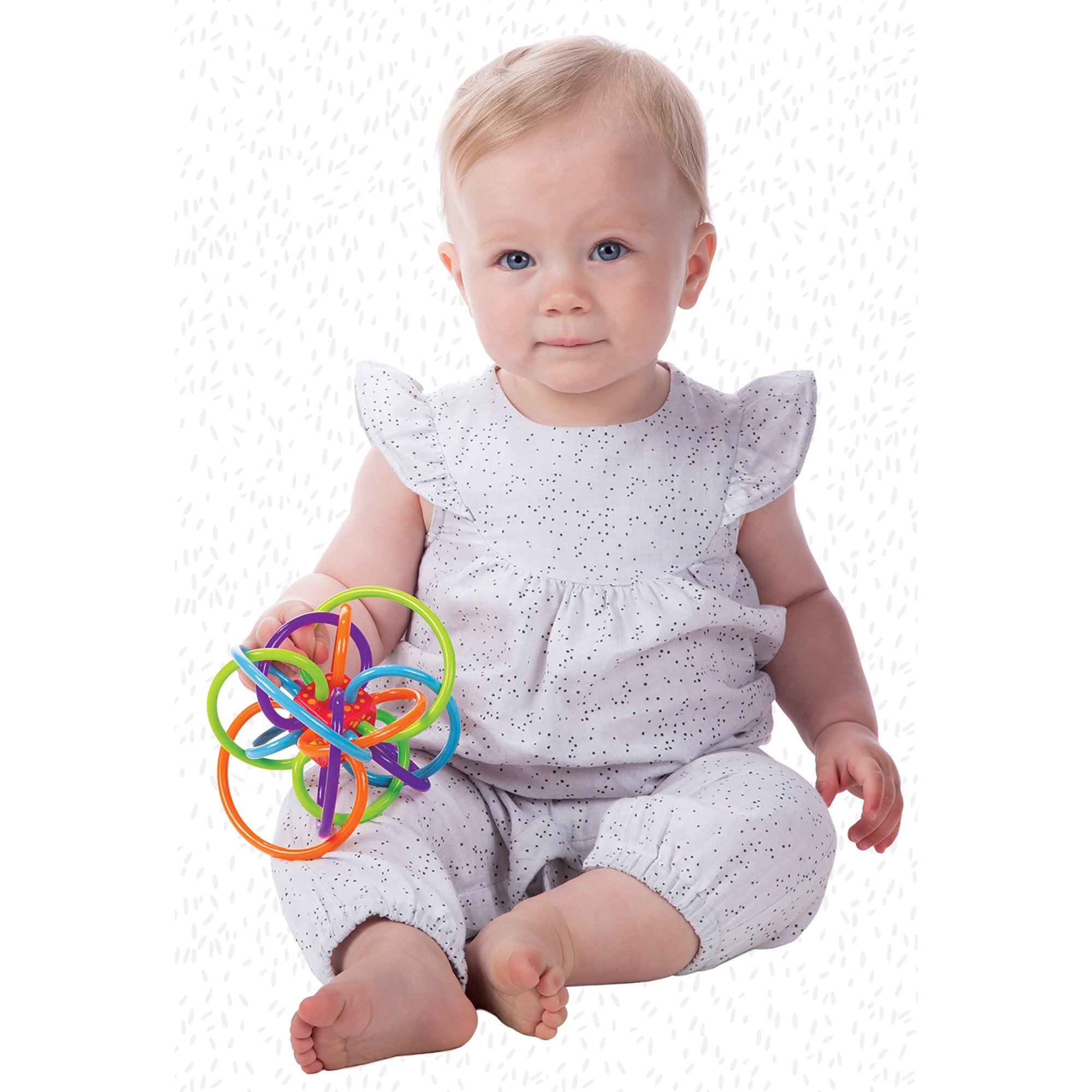 Manhattan Toy Winkel center cube rattle, quiet sound encourages cause-and-effect play.