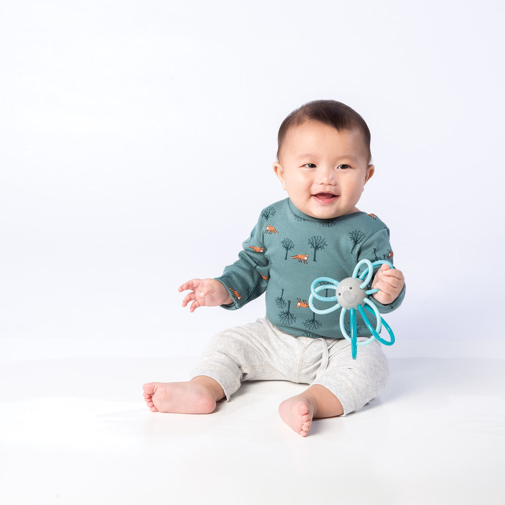 Manhattan Toy Winkel Elephant teether close-up showing soothing cooling option and bite-friendly design.