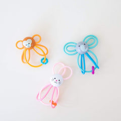 Manhattan Toy Winkel Monkey in diaper bag, portable toy for on-the-go play.