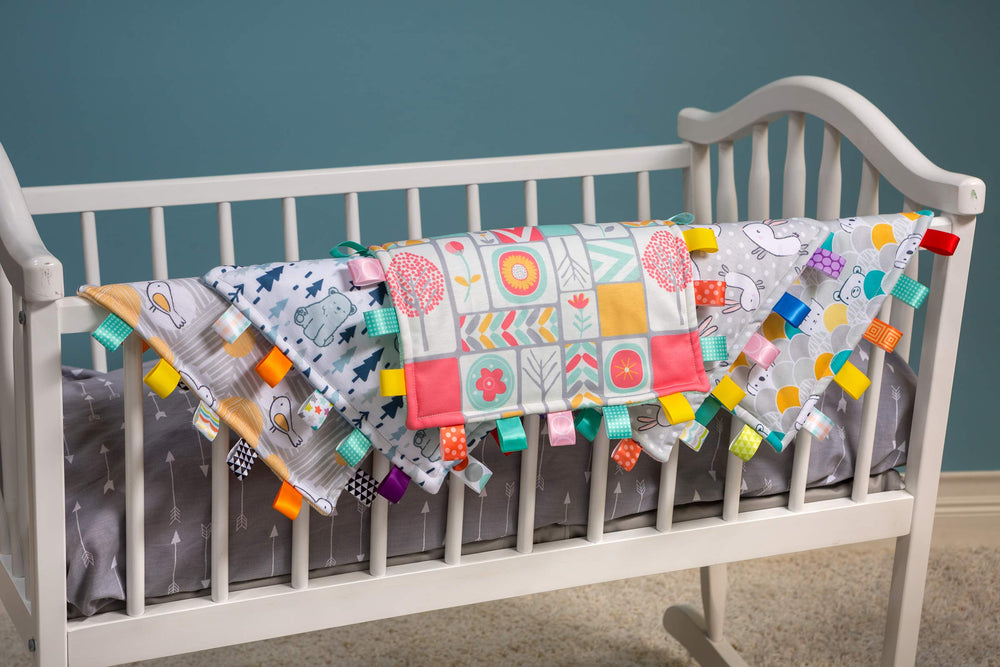Mary Meyer Taggies Original Blanket satin loop tags for tactile exploration and soothing sensory play.
