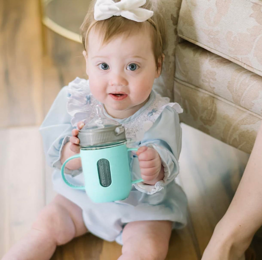 Mason Bottle dishwasher-safe silicone sleeve protects jars during travel.