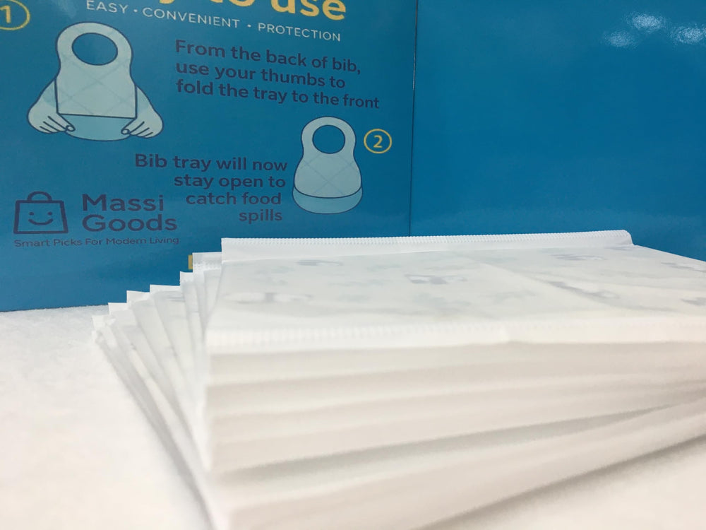 MassiGoods compact travel bibs shown in a bag for on-the-go feeding
