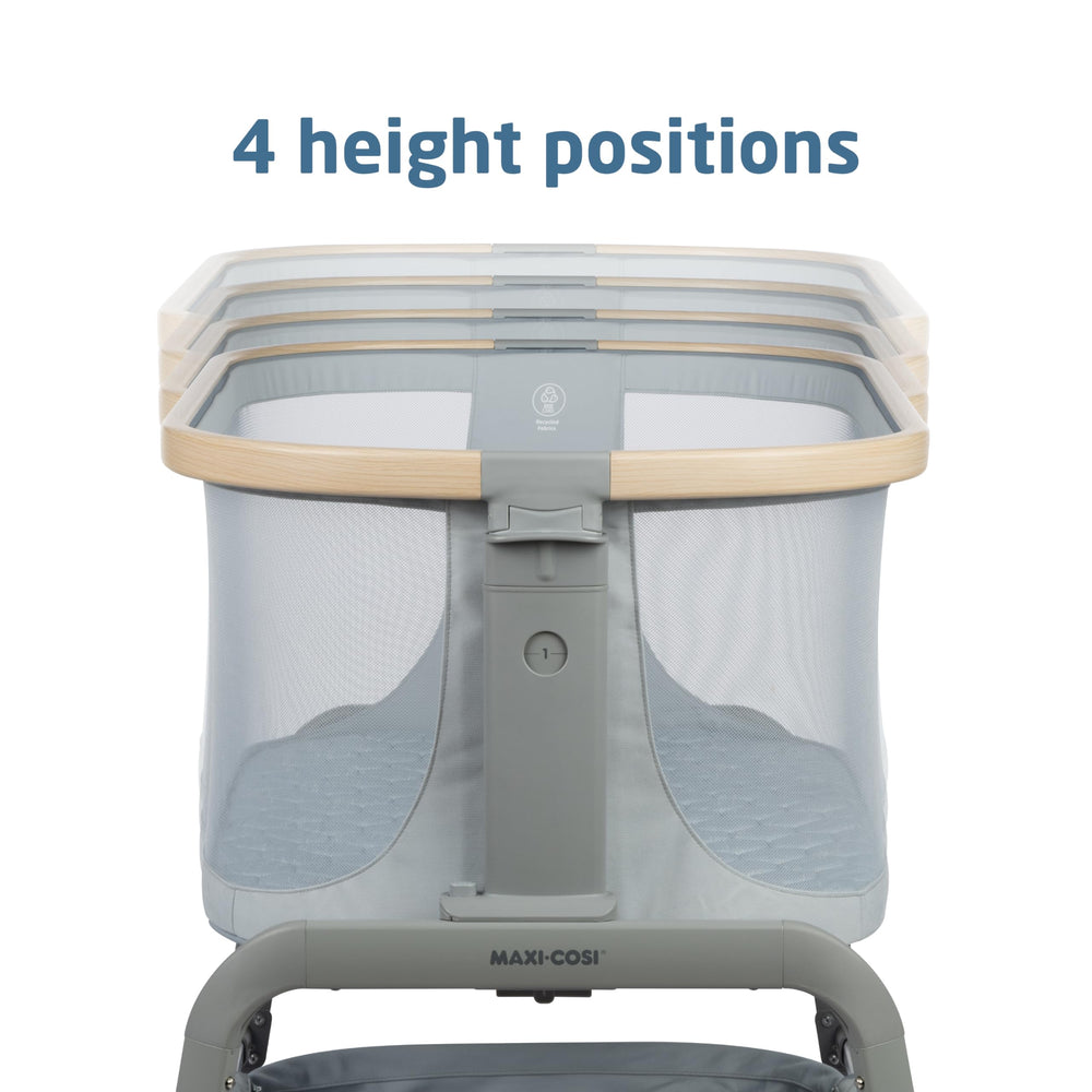 Maxi-Cosi Iora bassinet storage basket keeps essentials within arm's reach.