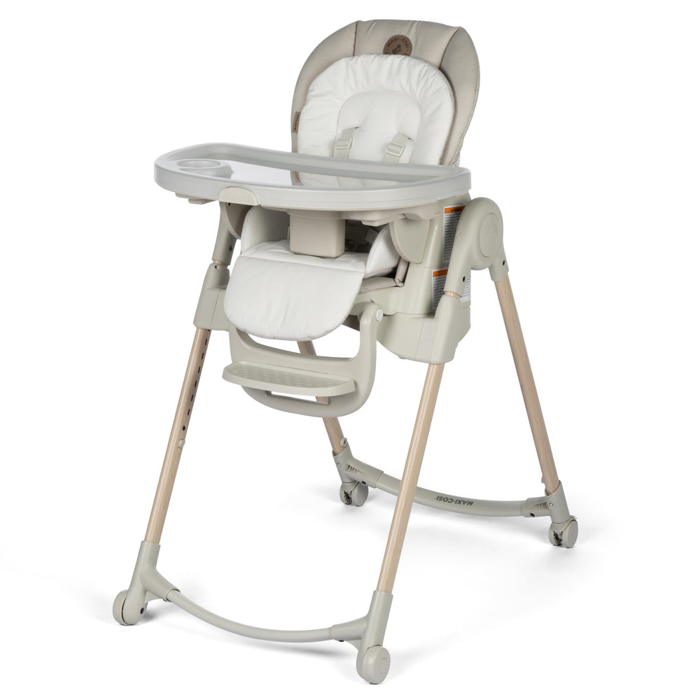 Maxi-Cosi Minla folded compact high chair for easy storage and portability.